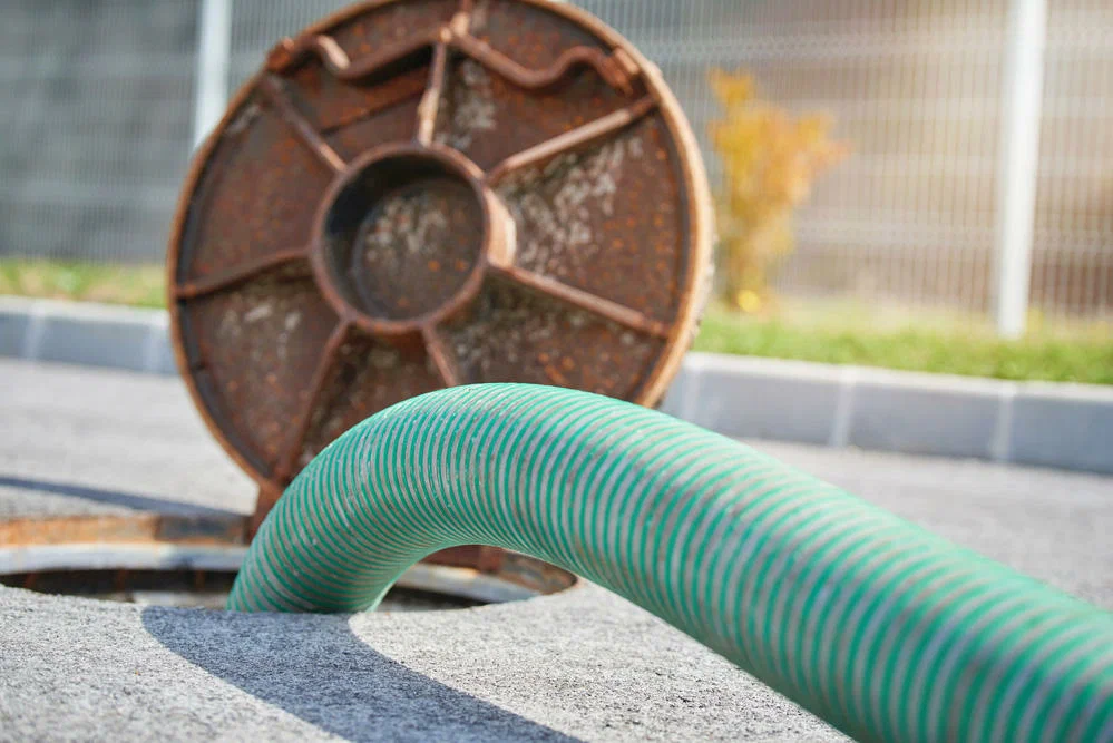 A hose going into a septic tank