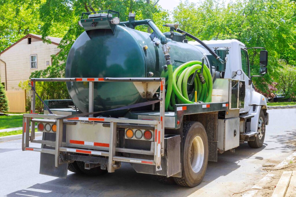 A septic truck parked on a street for emergency services
